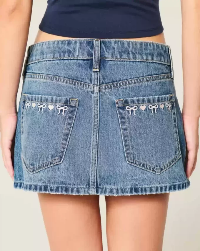 Düşük Bel İşlemeli Fiyonklu Kot Mini Etek
