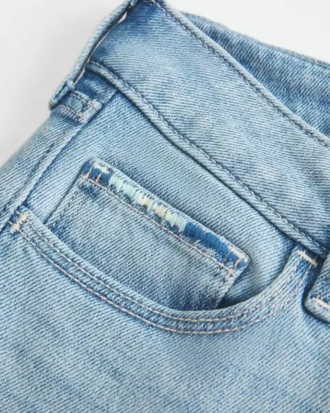 Düşük Bel Yırtık Açık Yıkama İşlemeli Bootcut Pantolon Düşük Bel Yırtık Açık Yıkama İşlemeli Bootcut Pantolon
