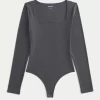 Ribanalı Dikişsiz Kumaş Kare Yaka Bodysuit Ribanalı Dikişsiz Kumaş Kare Yaka Bodysuit